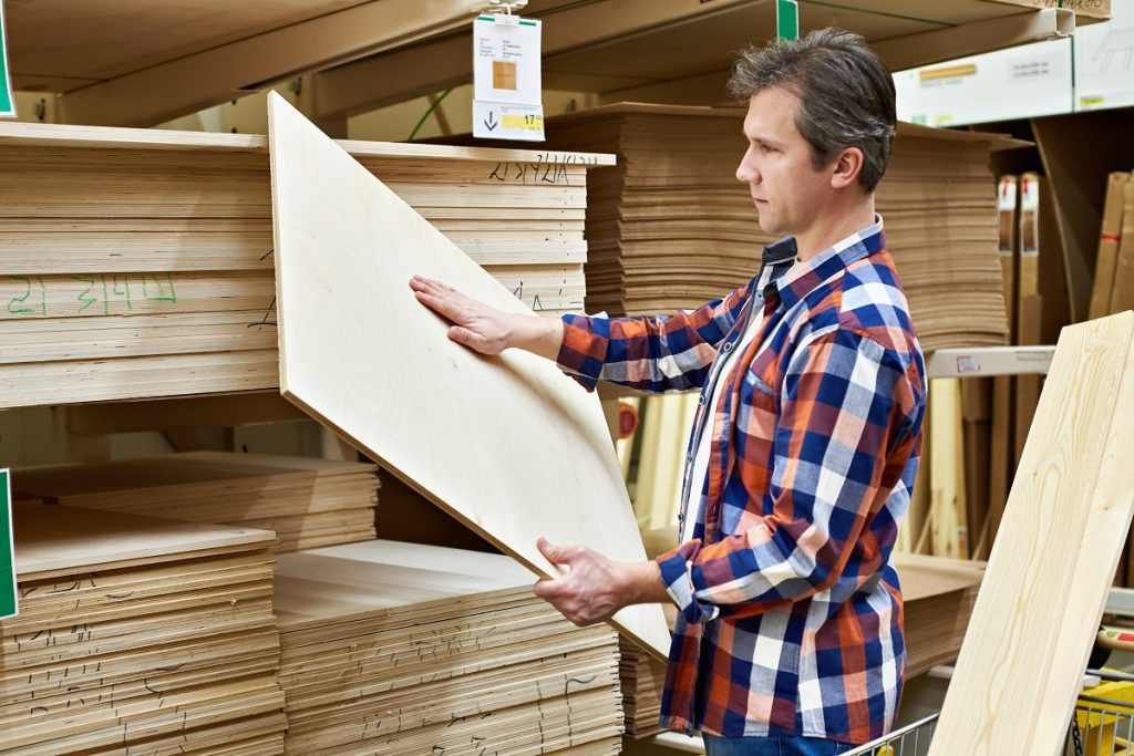 man buying a plywood