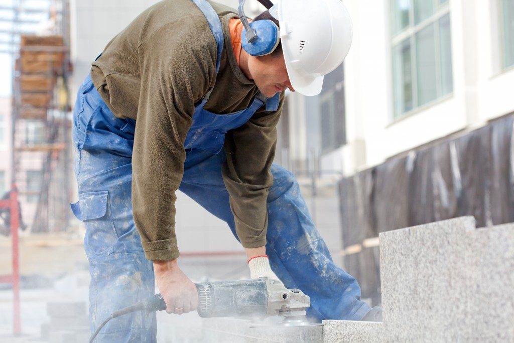 construction worker polishing concrete