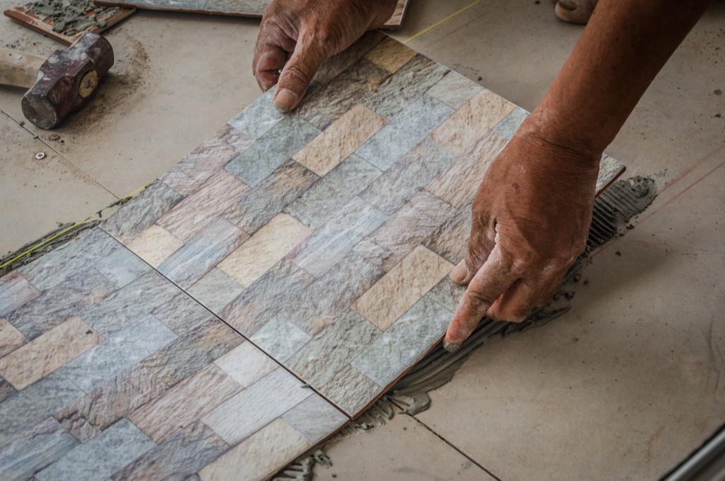 placing tile on floor