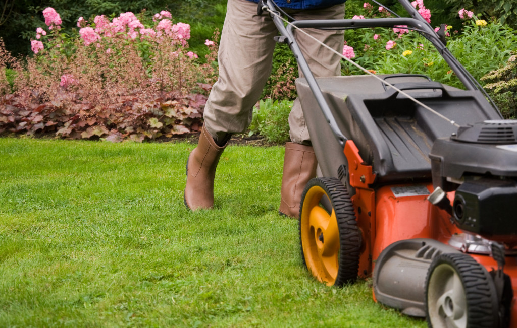 a person mowing the lawn