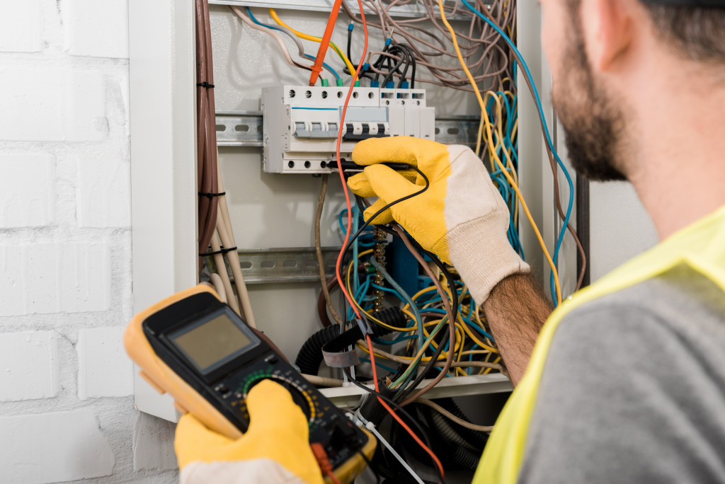 electrical panel being controlled by professional